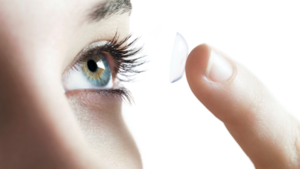 how to prepare for cataract surgery - a woman removing her contact lens