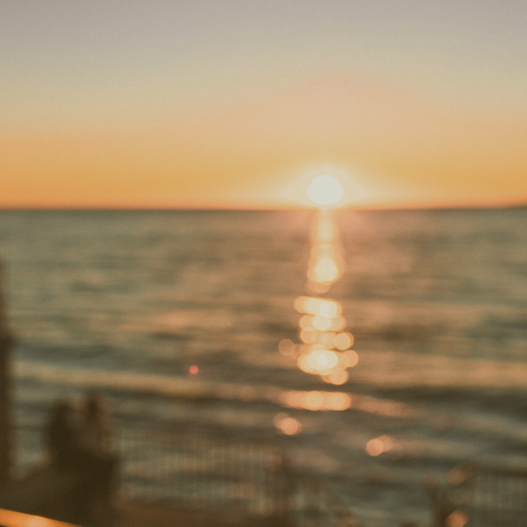 yag laser - blurry image of beach. Represents what vision is like with a post capsular opacity