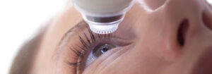 person under laser ready to have laser eye surgery