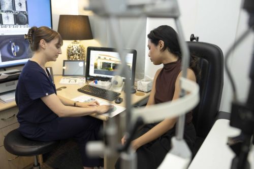 Doctor with patient discussing laser eye surgery